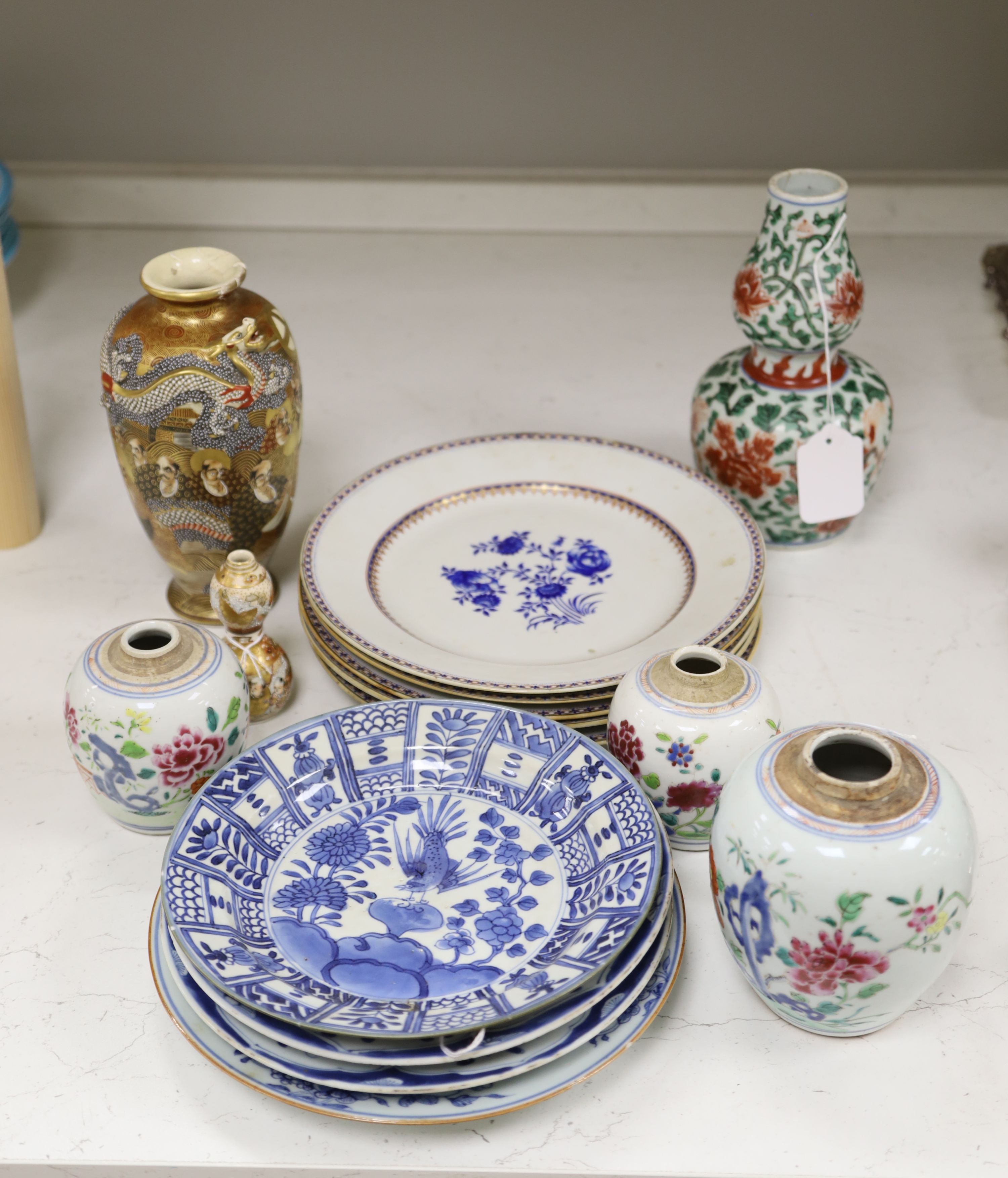 A collection of mixed Asian ceramics, including various Chinese blue and white export plates,